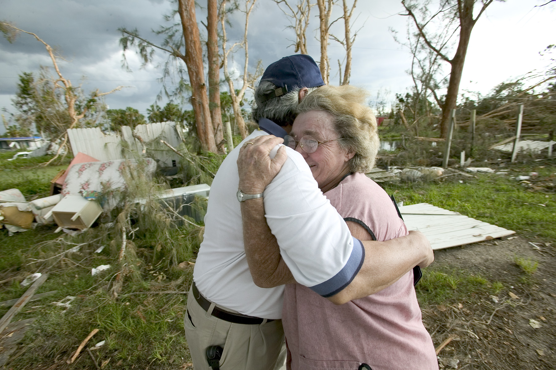 Hurricane Charley - A resident whose home was damaged embraces a FEMA ...