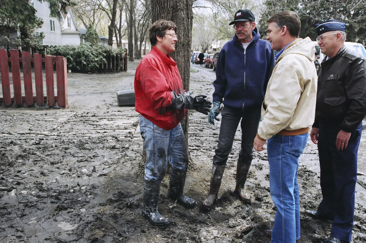 Image: Director Witt talks with residents