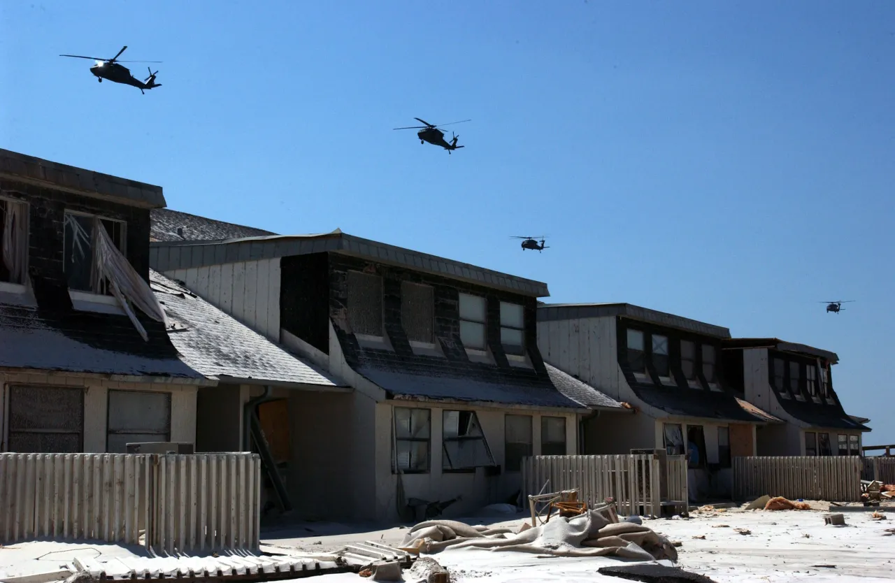 Image: Hurricane Ivan - Helicopters survey damage done to the area