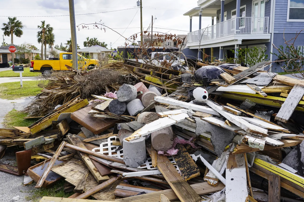 Image: Debris Gathered After Hurricane Hits Florida Neighborhood (1)