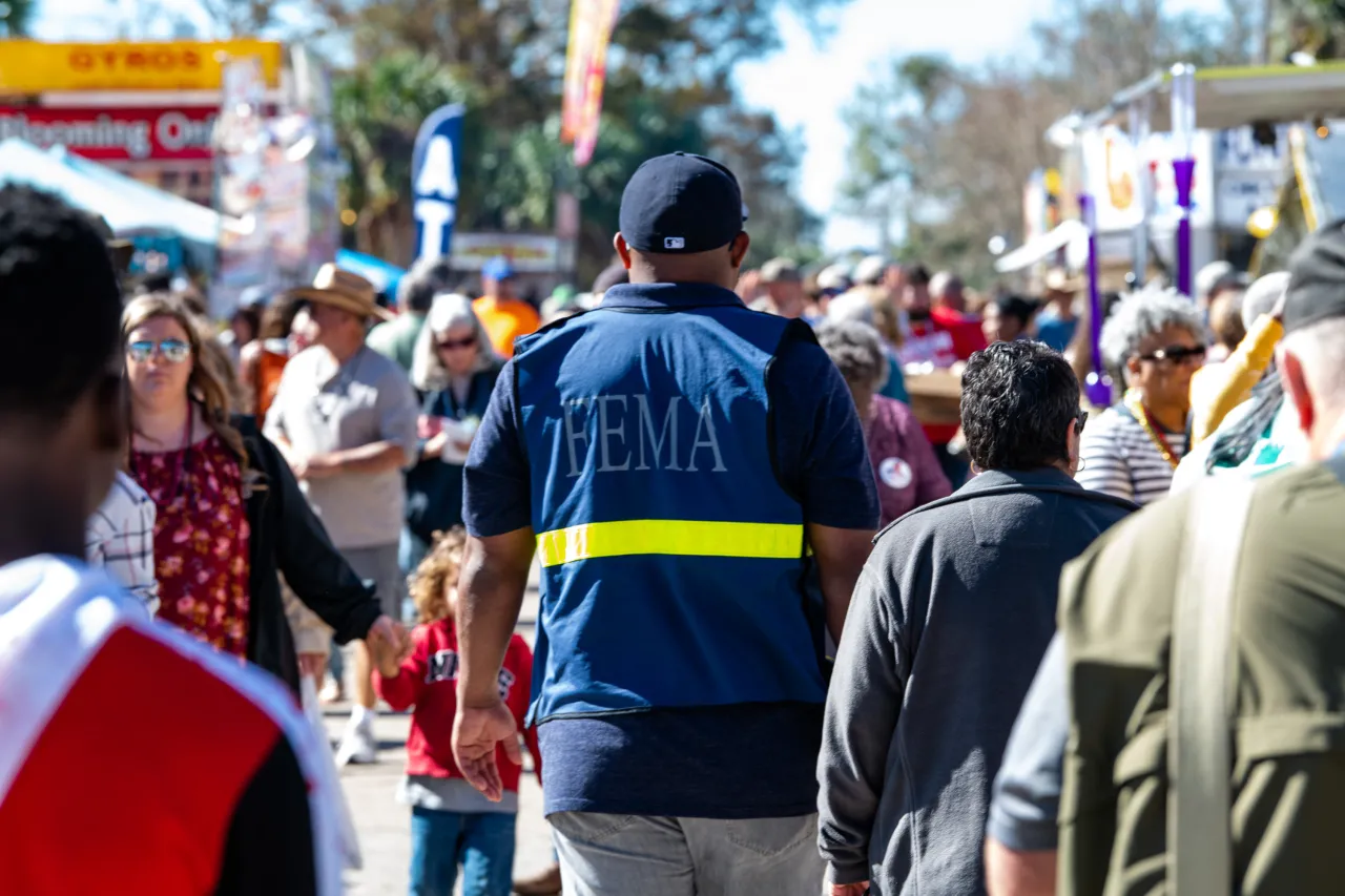 Image: FEMA Agent Walks Through Crowd