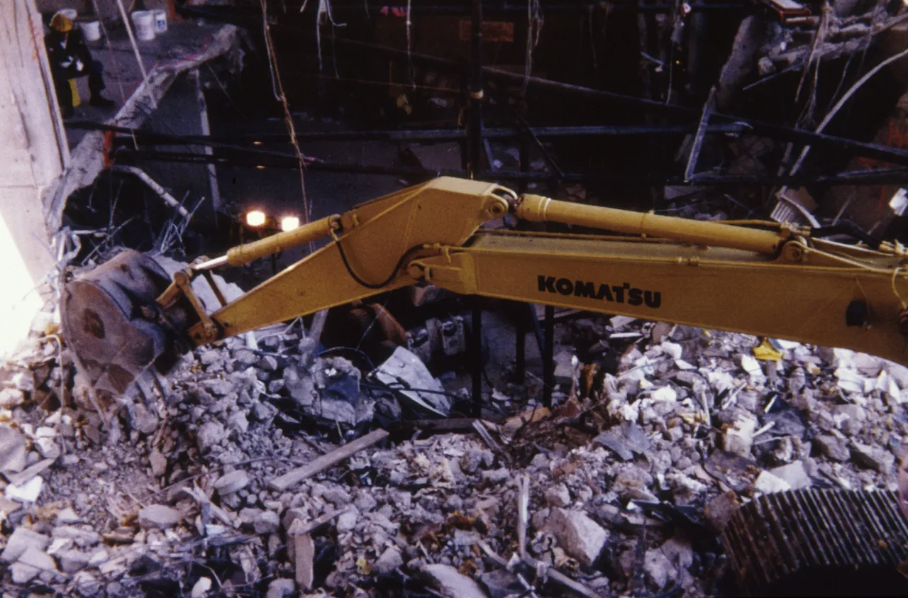 Image: Oklahoma City Bombing - Workers use heavy machinery to clear up the rubble