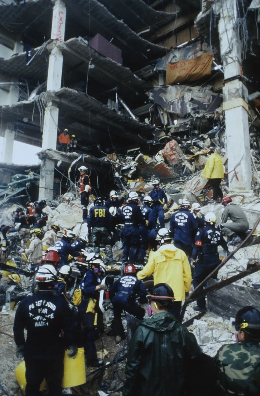 Image: Oklahoma City Bombing - Search and Rescue teams enter the rubble