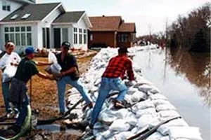 Image: Volunteers work together in a sandbag line (2)