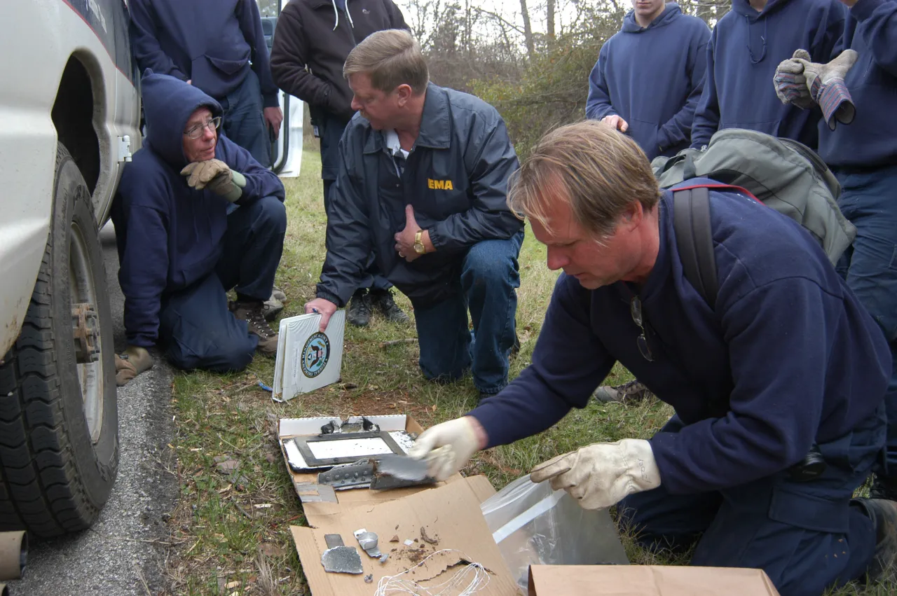 Image: Columbia Shuttle Disaster  - FEMA Officials and ALERT surveys shuttle debris