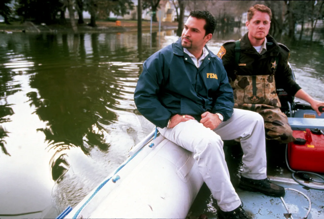 Image: A FEMA official rides along on a search of flood waters in Grand Forks