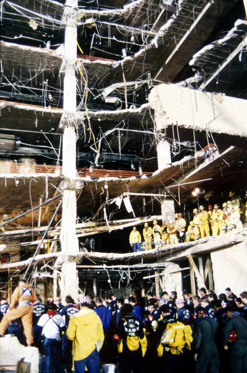 Image: Oklahoma City Bombing - Search and Rescue workers gather at the site