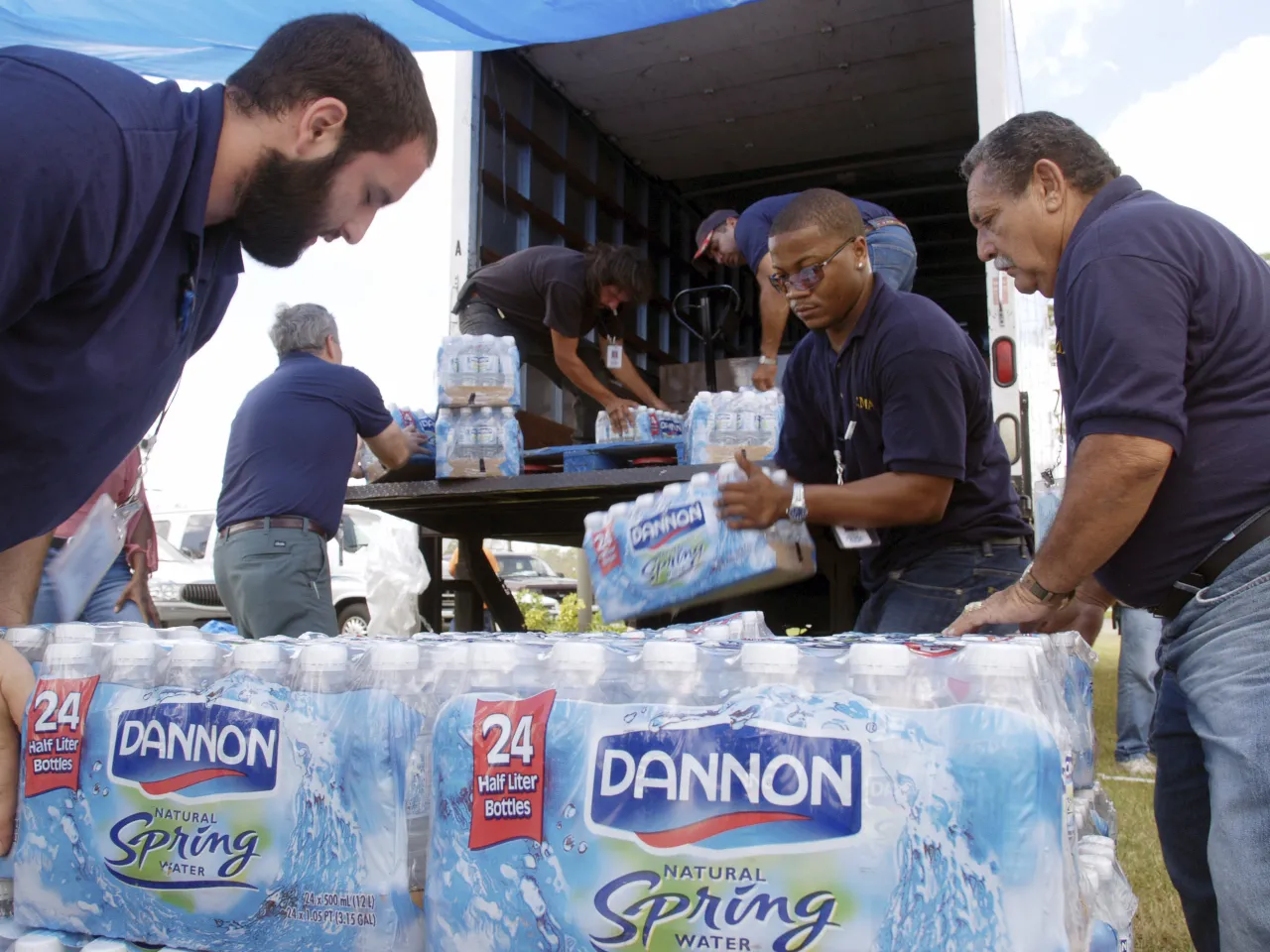 Image: FEMA workers unload water at a diversity outreach project