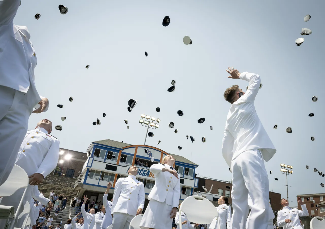 Image: U.S. Coast Guard Graduates Throw Up Their Caps in Celebration