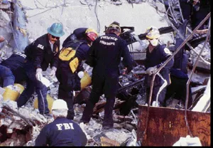 Image: Oklahoma City Bombing - Search and Rescue team surveys the damage