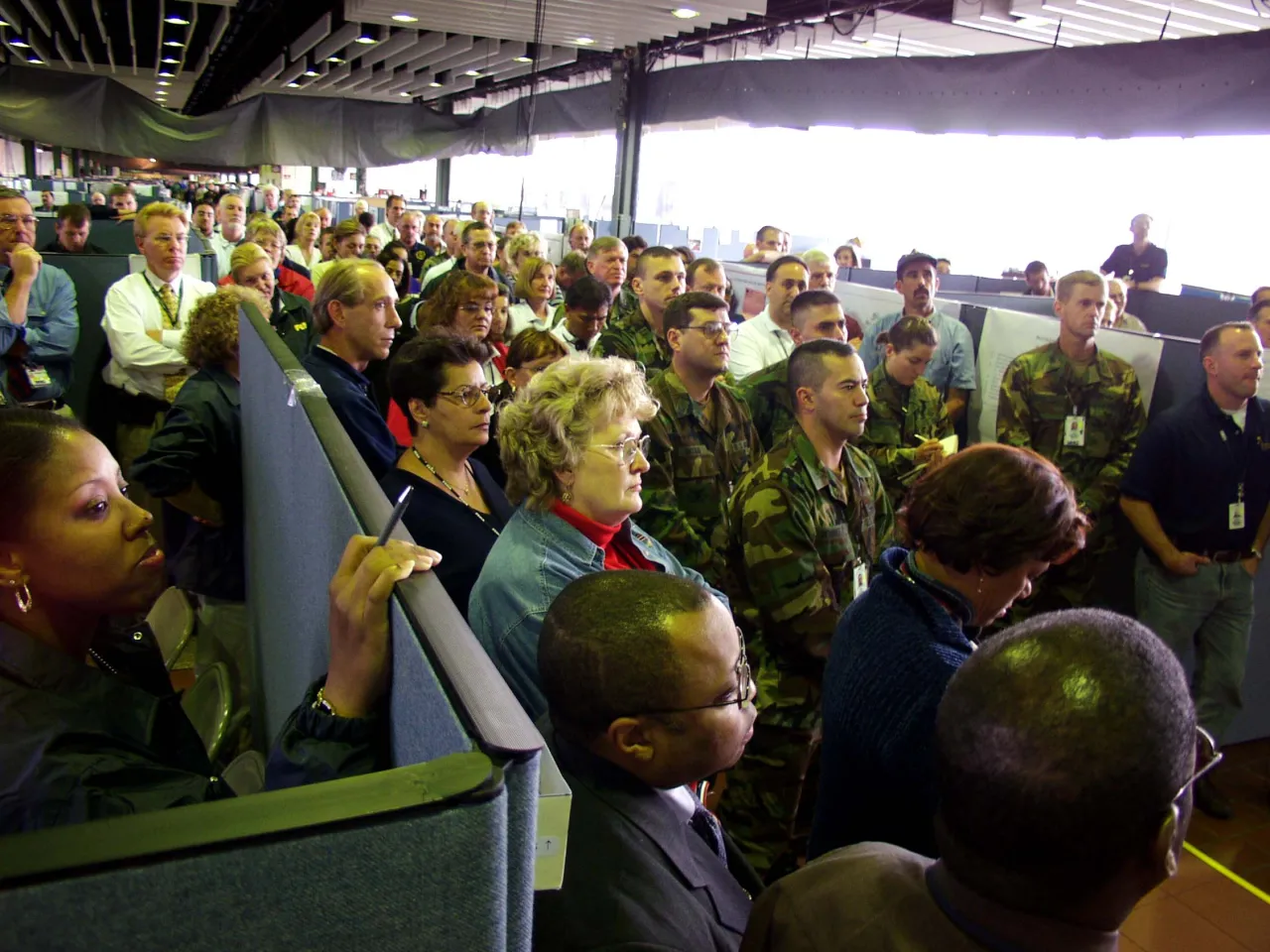 Image: 9/11 - FEMA workers in New York's DFO Listen to President Bush address