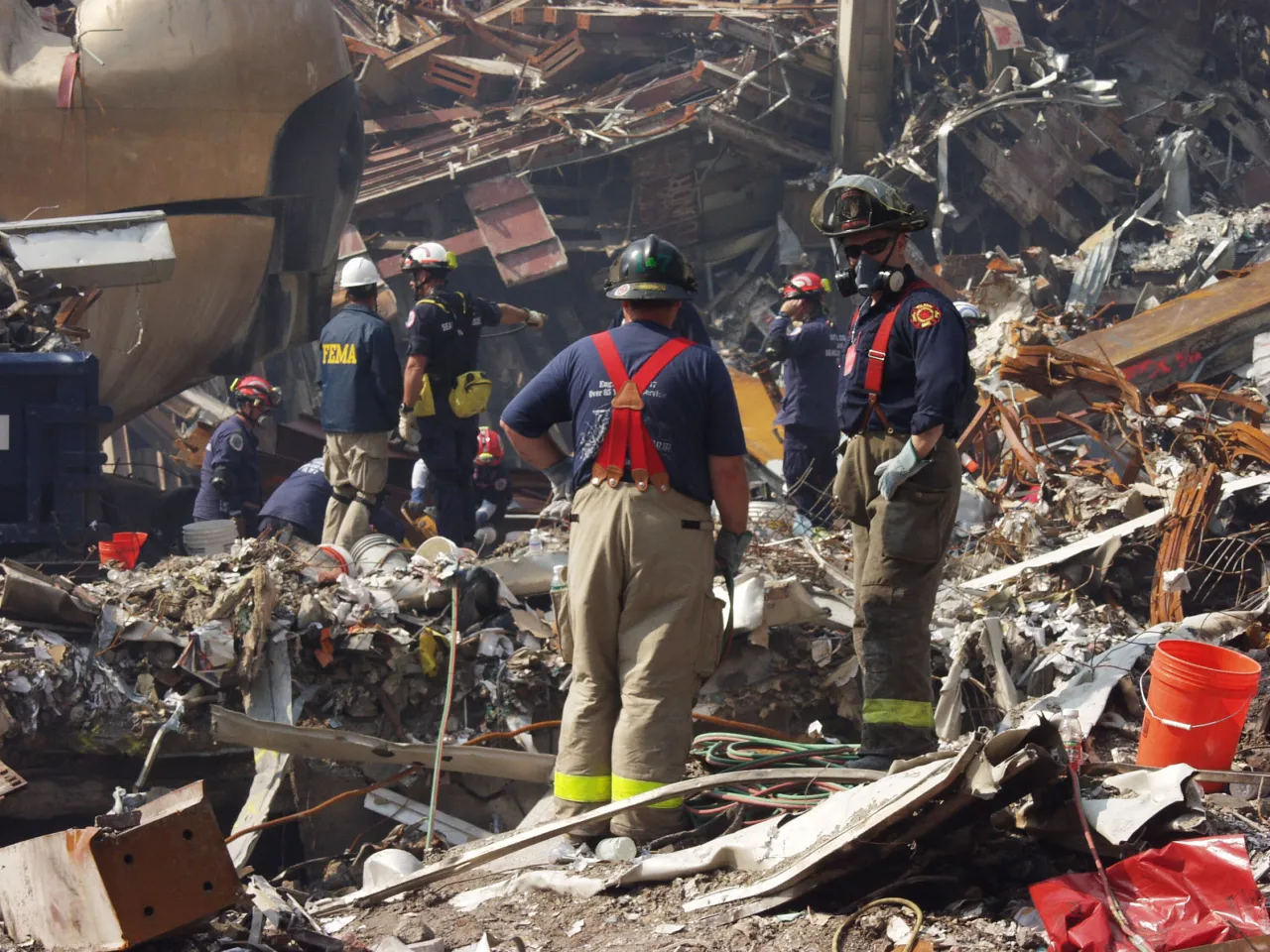 Image: 9/11 - New York City fire fighters and FEMA rescue workers continue to search for survivors at Ground Zero