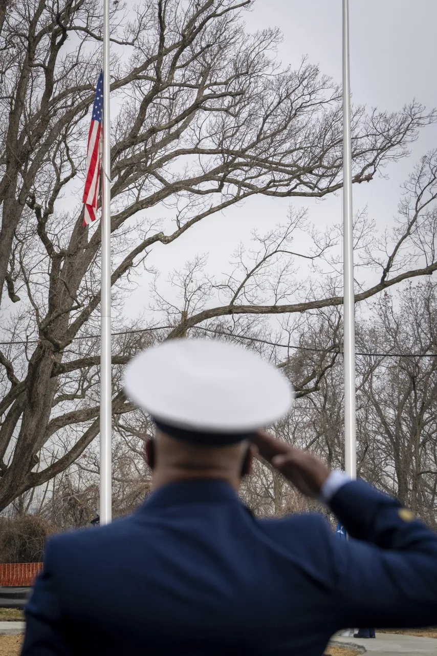 Image: Solider Salutes During Flag Raising Ceremony