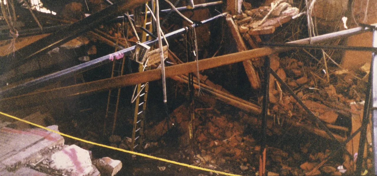 Image: Oklahoma City Bombing - A scene of the rubble and ladders that workers use to traverse it