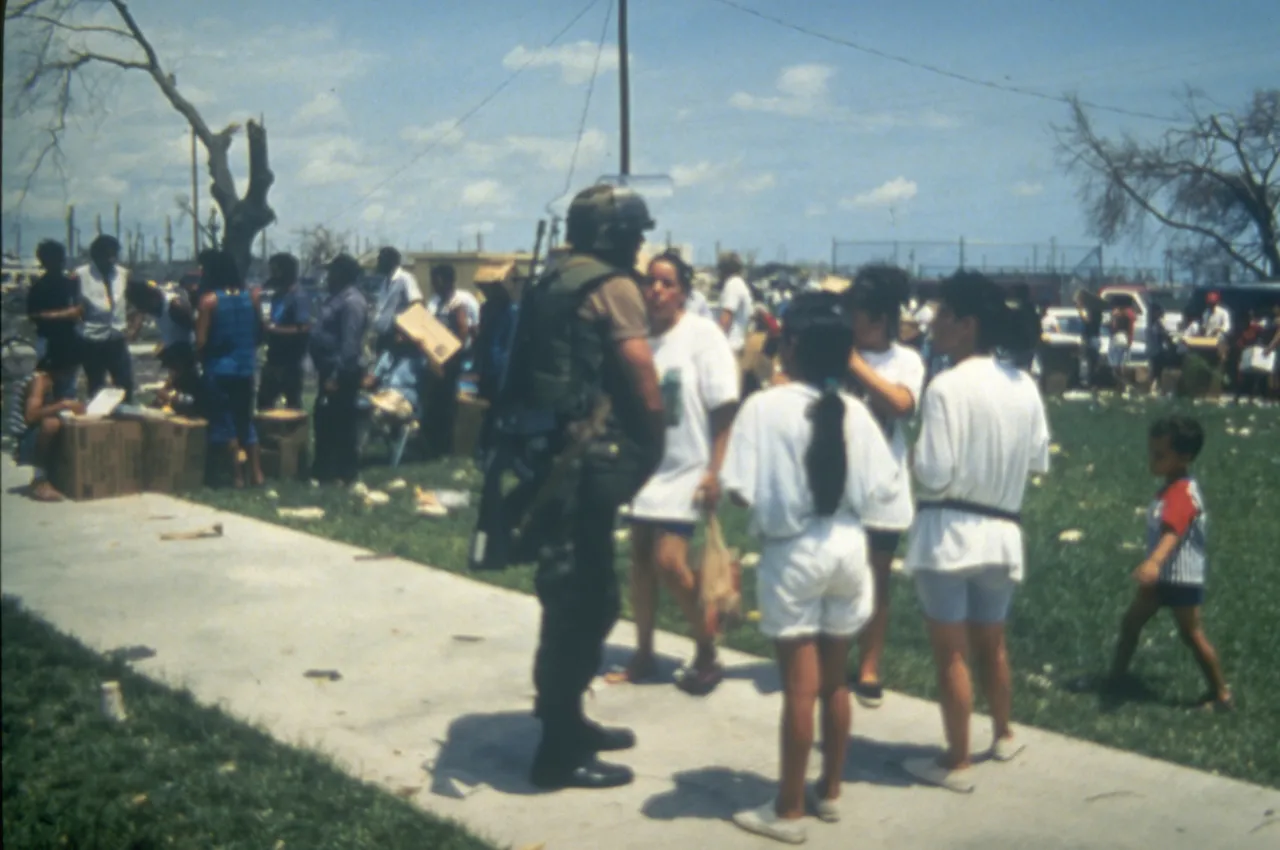 Image: Hurricane Andrew - A National Guard speaks with survivors