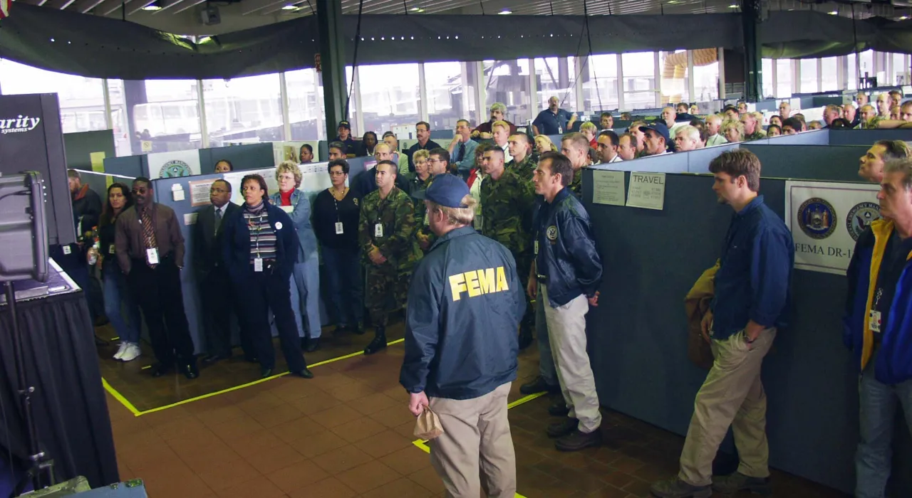 Image: 9/11 - FEMA workers in New York's DFO Listen to President Bush address (2)