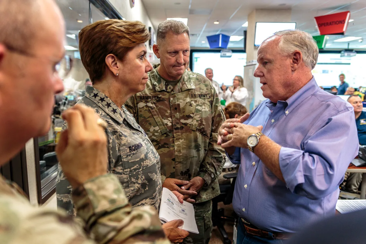 Image: NORAD Commander-in-Chief talks with the Federal Coordinating Officer