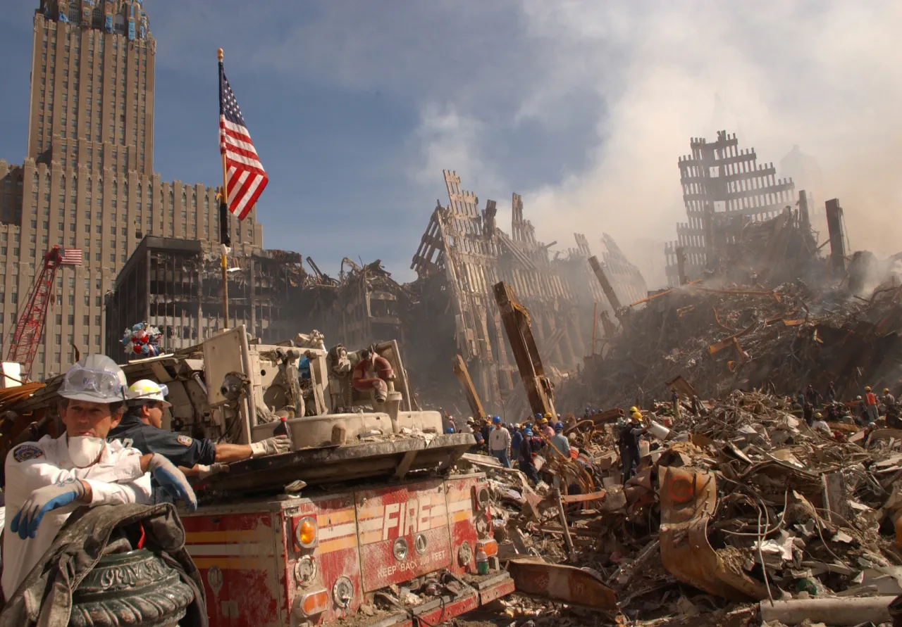 Image: 9/11 - Urban Search and Rescue teams inspect the wreckage at the World Trade Center