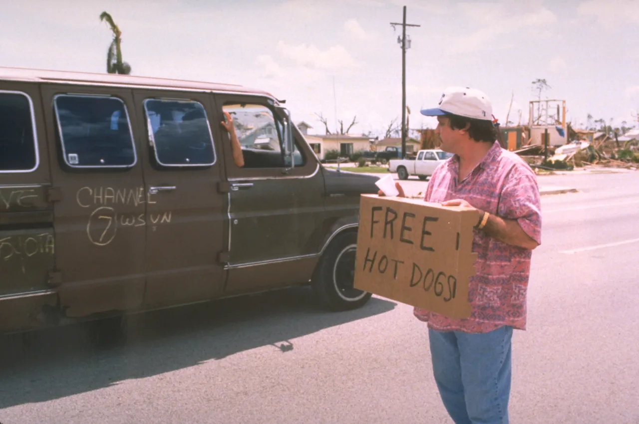 Image: Hurricane Andrew - A volunteer passes out free food