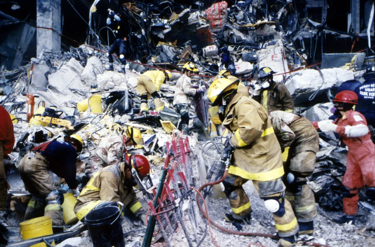 Image: Oklahoma City Bombing - Search and Rescue crews work to save those trapped beneath the debris