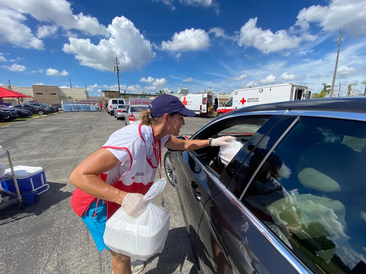 Image: Red Cross Volunteers Hand Out Food at a Distribution Center