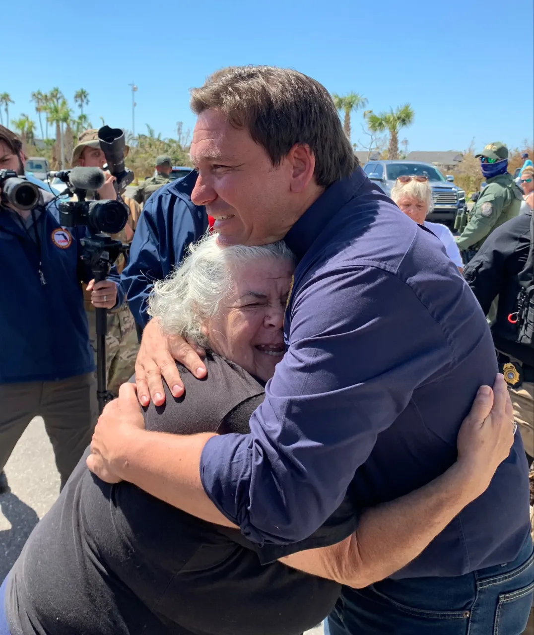 Image: Hurricane Ian Survivor Hugs Florida Governor Ron DeSantis