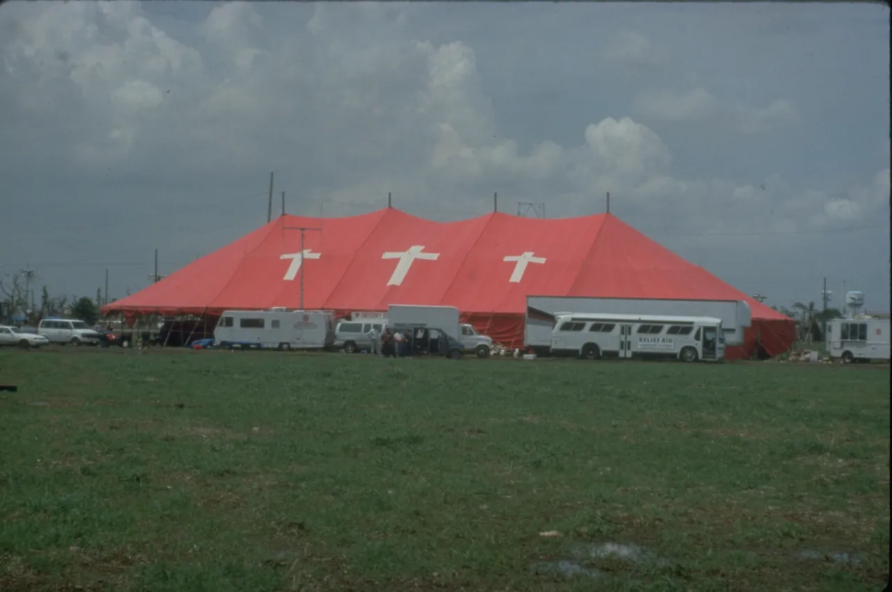 Image: Hurricane Andrew - A Red Cross tent is surrounded by support