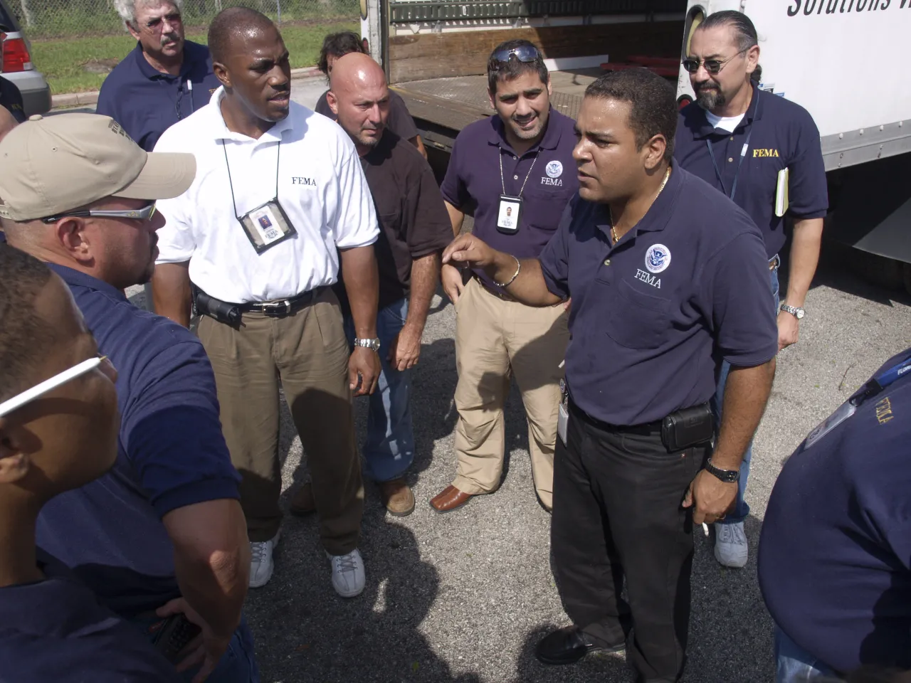 Image: FEMA employees discuss the plan for a diversity outreach project