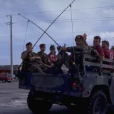 Image: Hurricane Andrew - A truck of volunteers ride to clean up