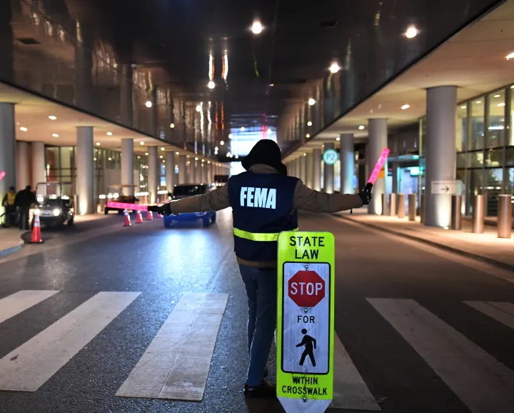Image: Federal Emergency Management Agency (FEMA) Agent Directs Traffic at Vaccine Site
