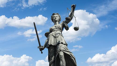 statue with scales of justice