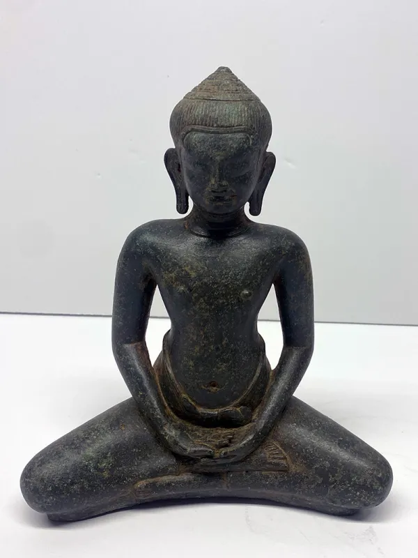 A bronze seated Buddha, which measures 8.5 inches high.