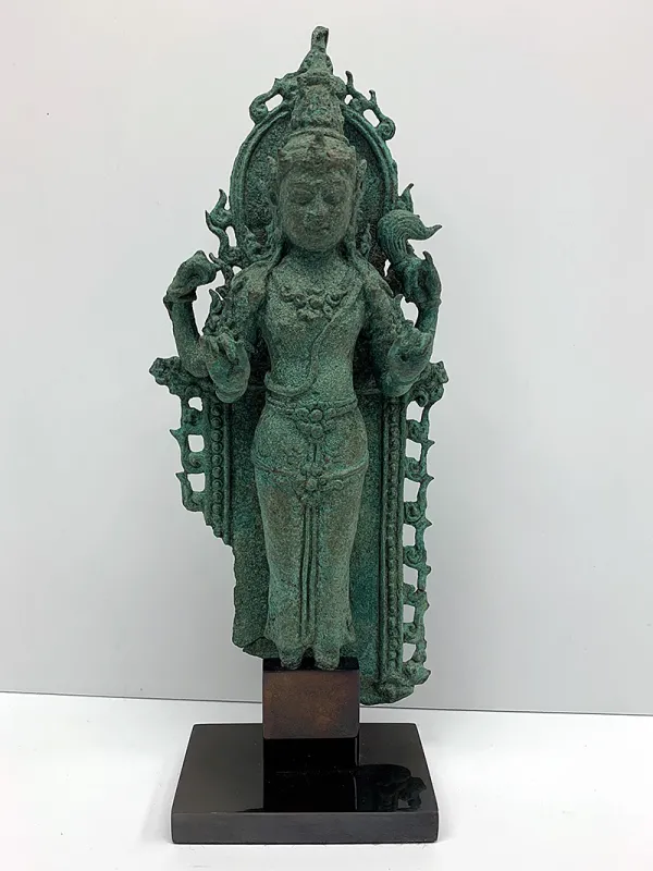 A bronze standing Vishnu, which measures 10.5 inches high.