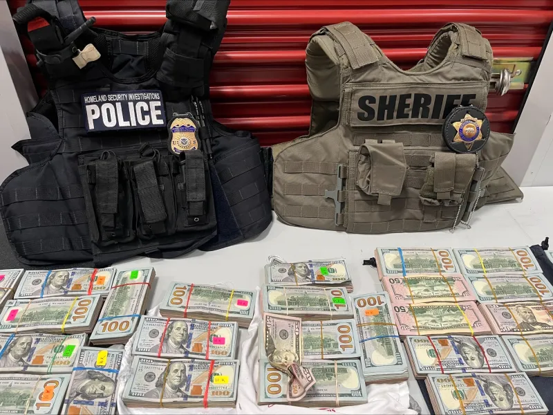 Photo of domestic law enforcement vests and seized currency