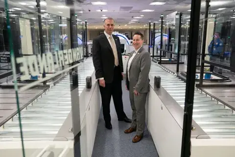Under Secretary Kusnezov and TSA Deputy Assistant Administrator Christina Peach stand at the self-service screening lanes in the Innovation Checkpoint at Harry Reid International Airport.