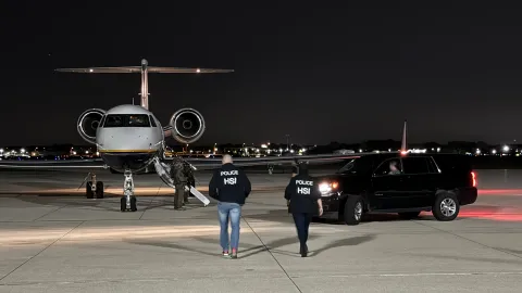 Photo of HSI agents approaching the airplane to arrest Sinaloa Cartel leaders.