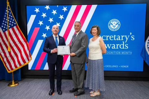 DHS Secretary Alejandro Mayorkas with Innovation Award recipient, Donald Anderson and family.