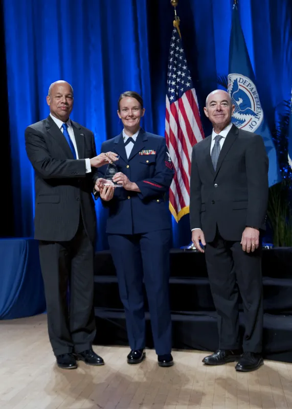 Secretary of Homeland Security Jeh Johnson and Deputy Secretary of Homeland Security Alejandro Mayorkas presented the Secretary's Award for Exemplary Service to Petty Officer 2nd Class Liesl C. Olson.