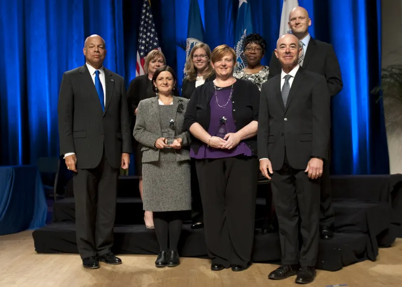 Secretary of Homeland Security Jeh Johnson and Deputy Secretary of Homeland Security Alejandro Mayorkas presented the Secretary's Award for Exemplary Service to U.S. Citizenship and Immigration Services Credit Card Implementation Team