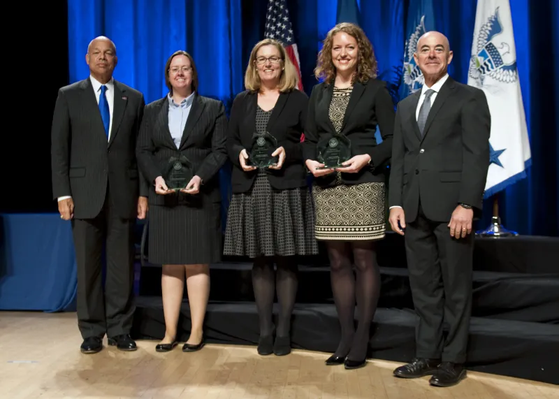 Secretary of Homeland Security Jeh Johnson and Deputy Secretary of Homeland Security Alejandro Mayorkas presented the Secretary's Unit Award to the Office of Civil Rights and Civil Liberties Instruction - Disclosure of 1367 Information Team Amy Cucinella, Miriam R. Moore, Wendy Crompton, Colleen Zengotitabengoa, and Rena Cutlip-Mason, during the Secretary's Award Ceremony held Oct. 26, 2016.