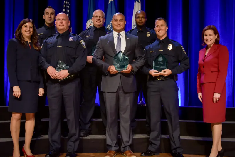 The Federal Protective Service Defense Tactics Instructors Team receive the the Secretary's Award for Valor at the Department of Homeland Security Secretary's Awards Ceremony in Washington, D.C., Nov. 8, 2017. The team was honored for saving the life of a fellow instructor, who suffered from a medical emergency during training, by administering life saving measures, which saved the instructor's life. Official DHS photo by Jetta Disco.