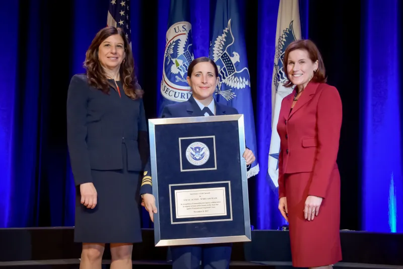 Lt. Cmdr Jennifer Runion, on behalf of the crew of the U.S. Coast Guard Cutter Active, accepts the Secretary's Unit Award at the Department of Homeland Security Secretary's Awards Ceremony in Washington, D.C., Nov. 8, 2017. The Active crew is honored for their outstanding interagency collaboration in support of team achievements on the front line against Transnational Organized Crime. Official DHS photo by Jetta Disco.