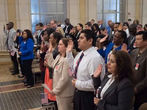 Citizenship candidates participate in a naturalization ceremony. (Photo provided by USCIS)