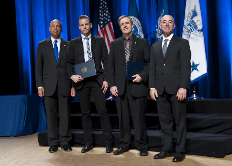 Secretary of Homeland Security Jeh Johnson and Deputy Secretary of Homeland Security Alejandro Mayorkas presented the Secretary's Unity of Effort Award to the Personnel Surety Program Implementation Team