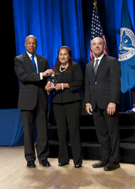 Secretary of Homeland Security Jeh Johnson and Deputy Secretary of Homeland Security Alejandro Mayorkas presented the Secretary's Award for Exemplary Service to Catherine A. Wright