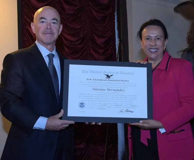 Deputy Secretary Mayorkas and Antonia Hernandez pose with a certificate