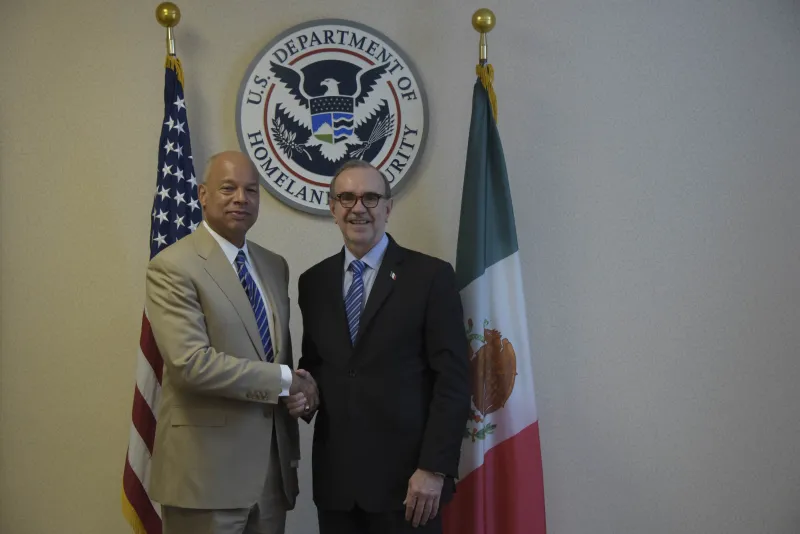 Secretary Johnson shakes hands with Ambassador Sada