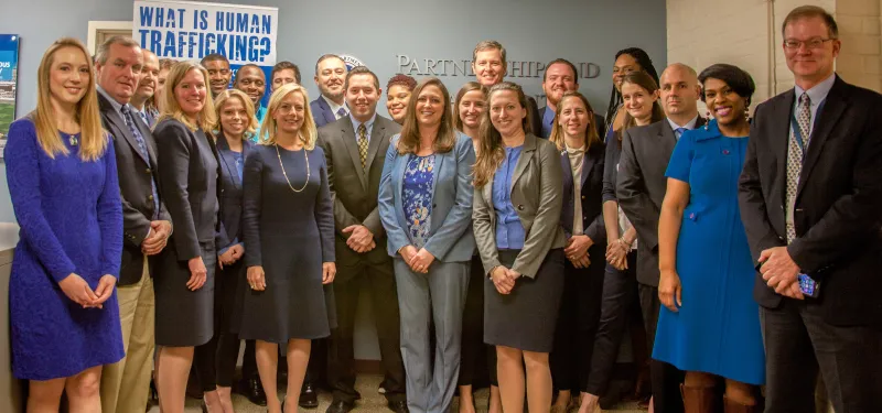 Secretary Nielsen joins the team wearing blue at the Office of Public Engagement on Human Trafficking Awareness Day to raise awareness to end human trafficking. (DHS Official Photo/Meagan Blake)
