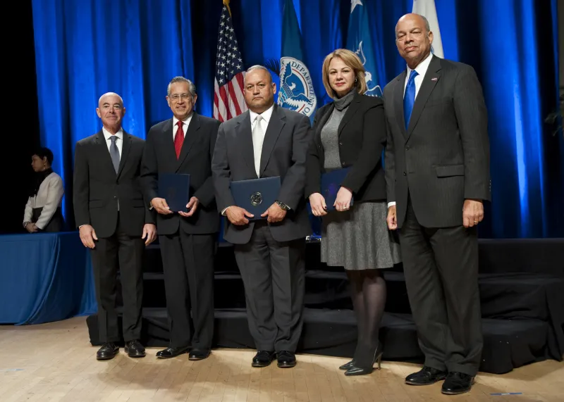 Secretary of Homeland Security Jeh Johnson and Deputy Secretary of Homeland Security Alejandro Mayorkas presented the Secretary's Customer Service Award to members of the U.S. Citizenship and Immigration Services District 18 Unified Effort Team (San Antonio District)