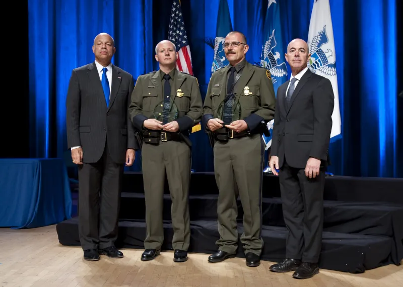 Secretary of Homeland Security Jeh Johnson and Deputy Secretary of Homeland Security Alejandro Mayorkas presented the Secretary's Award for Valor to U.S. Customs and Border Protection Zone 1 River Team Phillippe Morgue and Nathan Kimball.